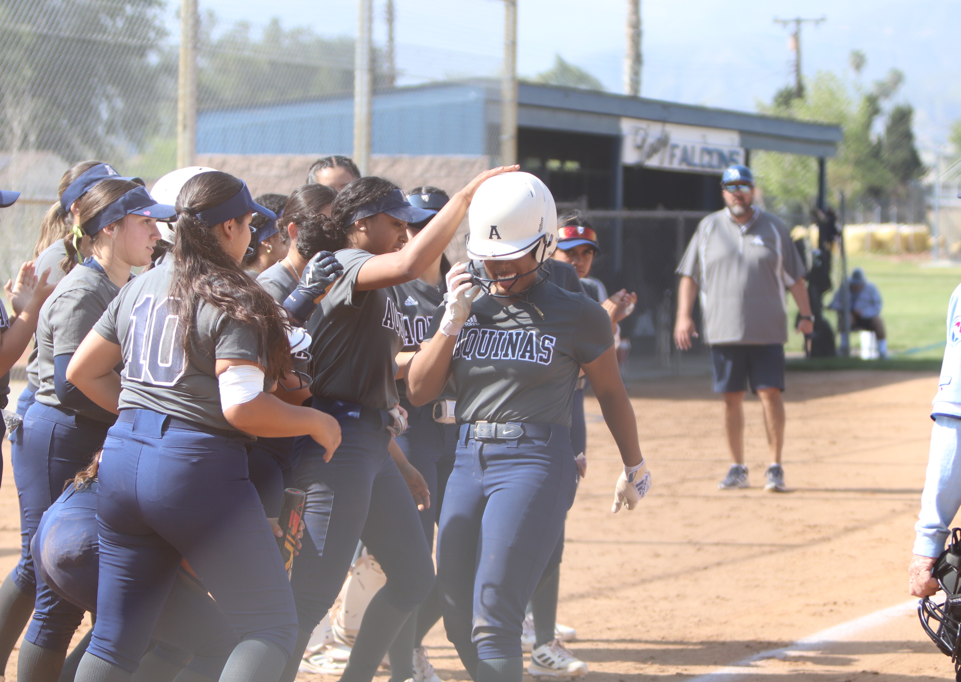 Butler celebrates with her friends and teammates. Photo: John Murphy. 
